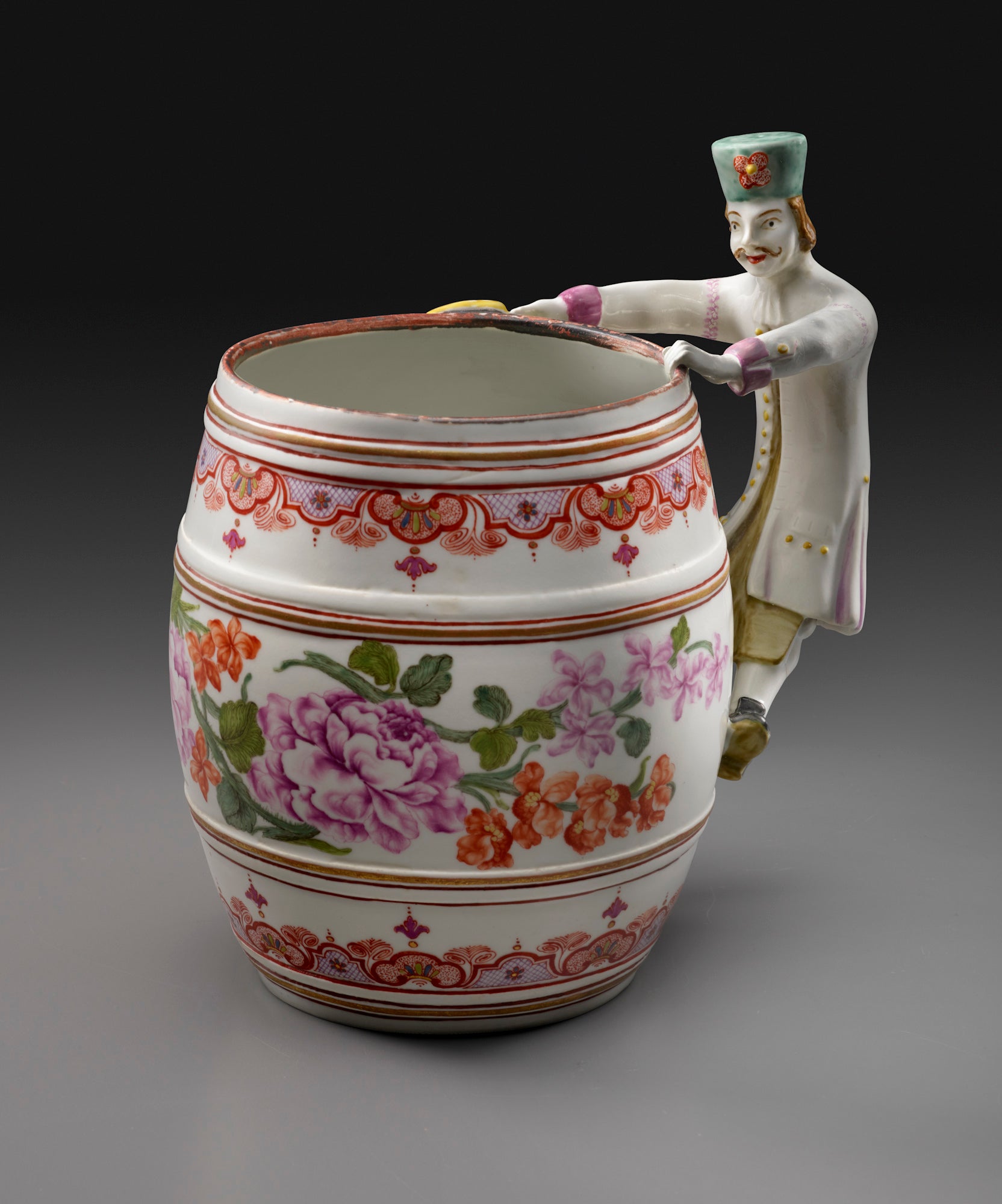 colorful porcelain tankard with male figurine as handle