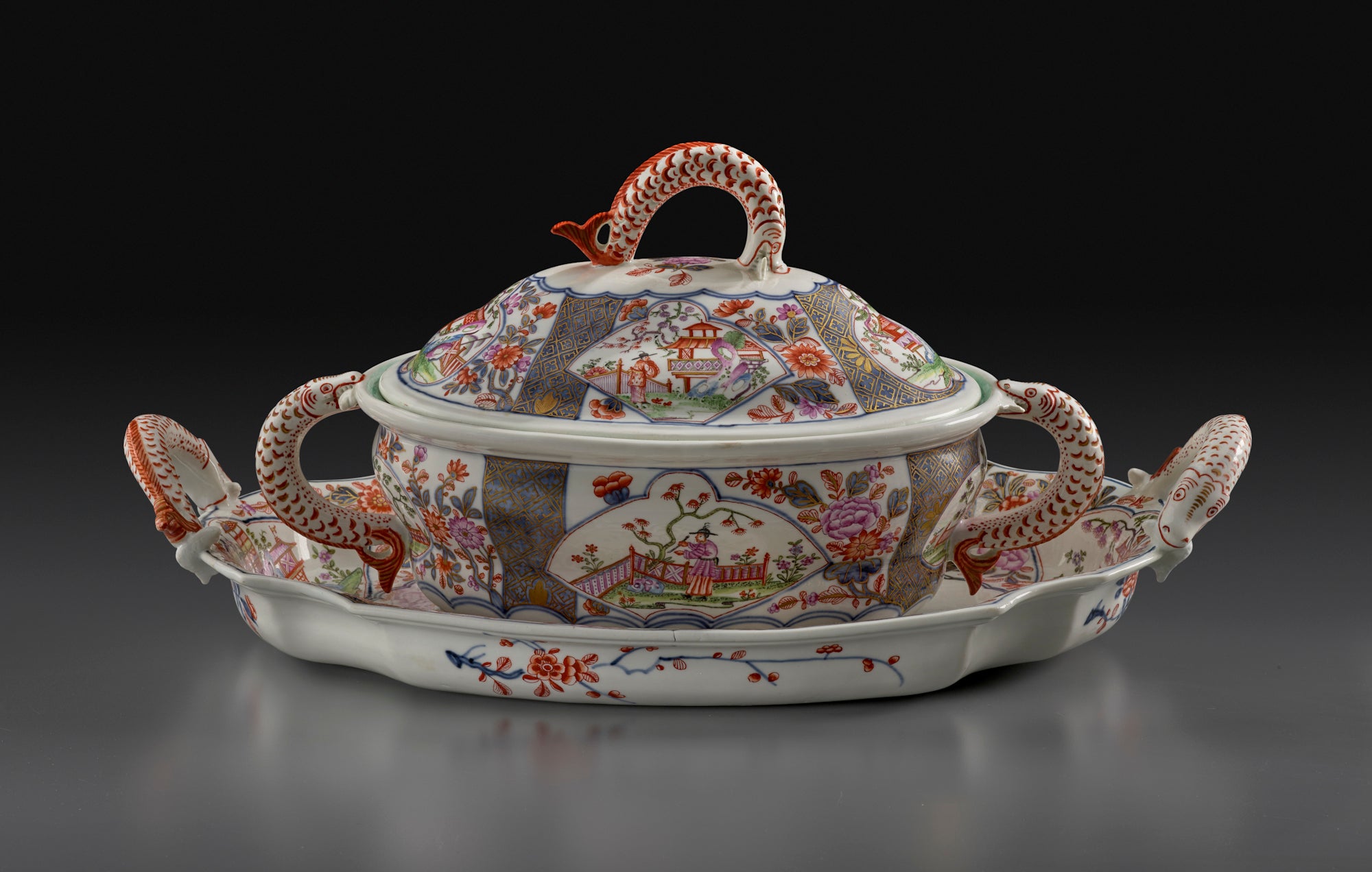 photo of porcelain tureen and stand decorated with colorful scenes