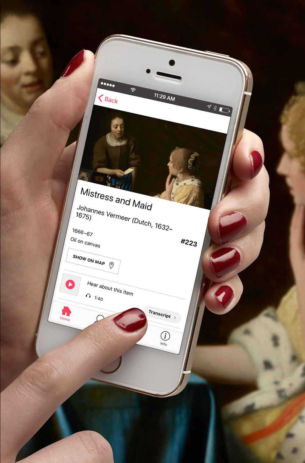 photo of hand holding phone, and using app to learn about painting of two women