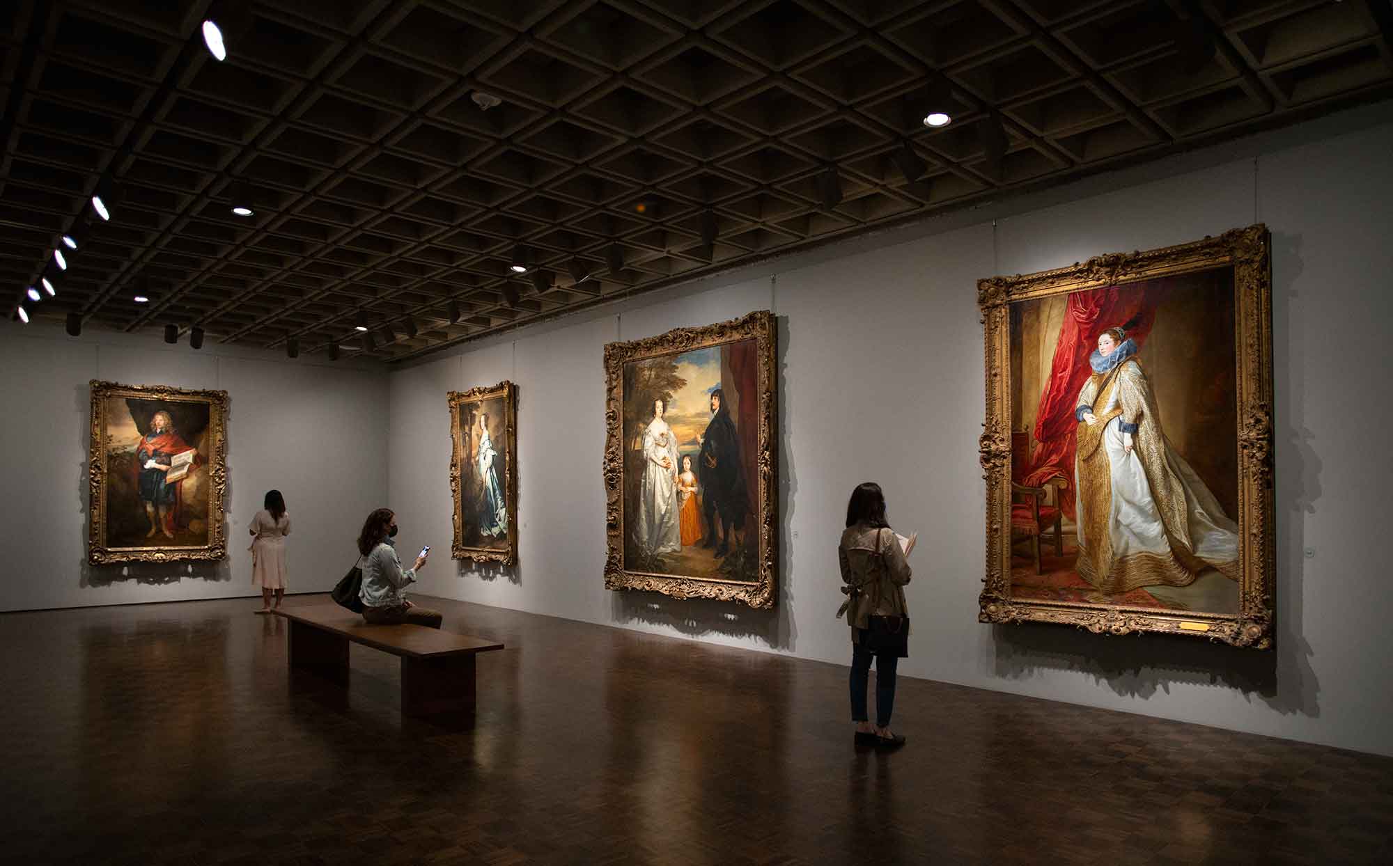 Frick Madison gallery displaying four paintings and patrons