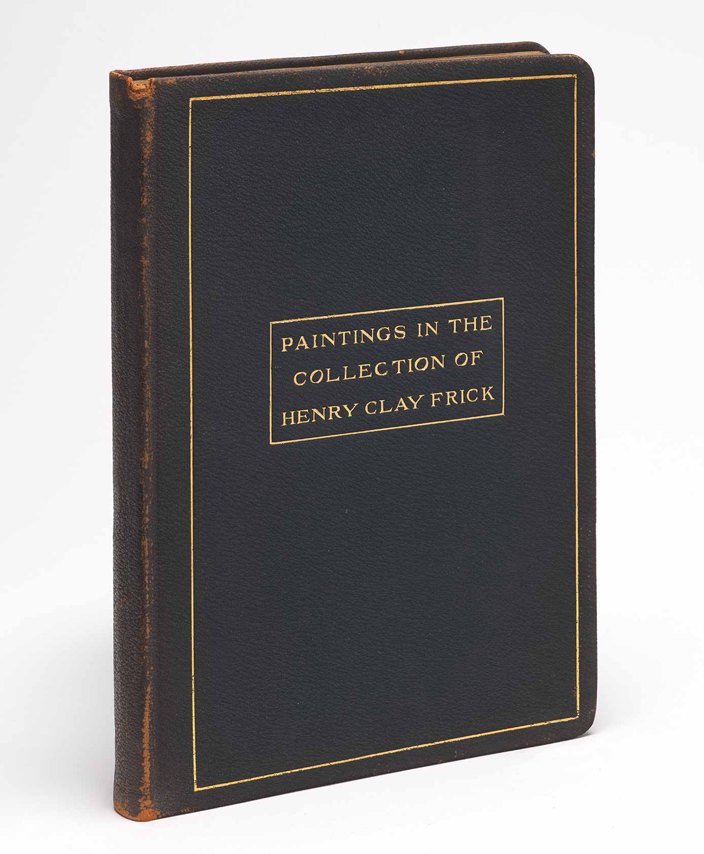Blue bound book with an embossed gold title reading "Paintings in the Collection of Henry Clay Frick"