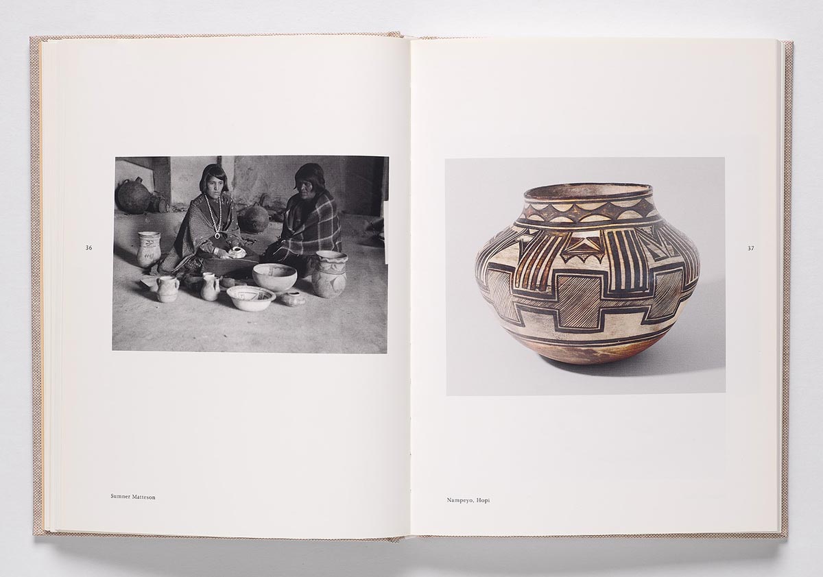 Book spread featuring a black-and-white photo of two Native Americans with pottery at left and a piece of pottery with geometric designs illustrated at right