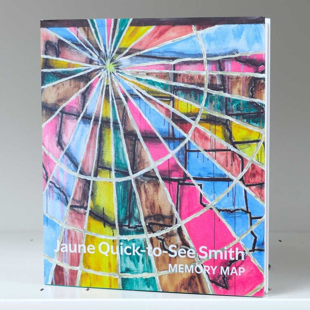 Book cover featuring ring of concentric circles fragmented into colorful triangles