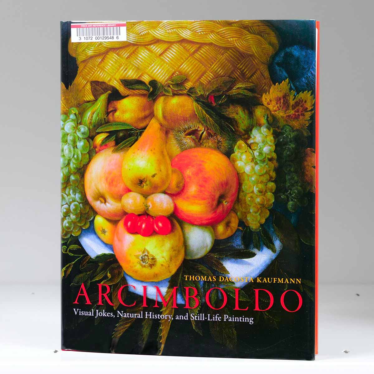 Book cover featuring a portrait of a man made up of fruits and a basket