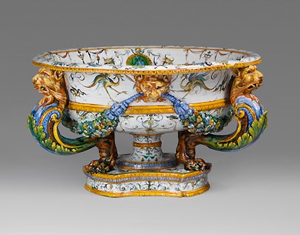 white, blue, orange, and green basin with animal heads
