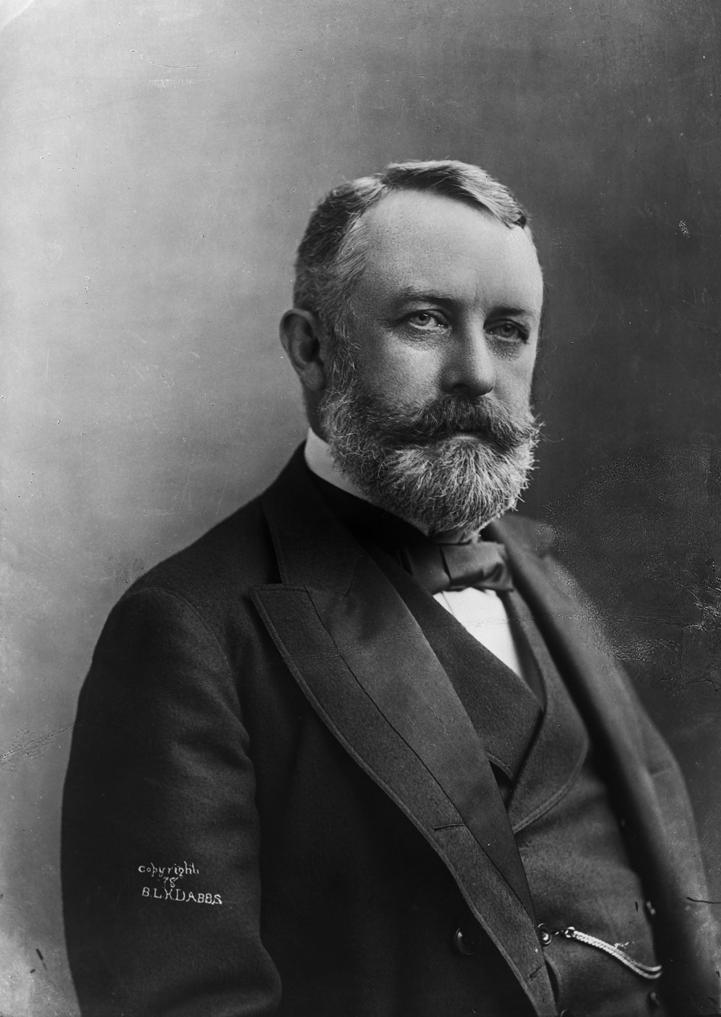 black and white photograph of seated henry clay frick wearing vest and suit