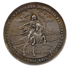 photo of medal with man riding upright horse