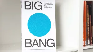Book on a white shelf featuring the words "Big Bang" and a large glittery blue circle in the center