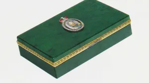 photo of green box, with man's portrait at center