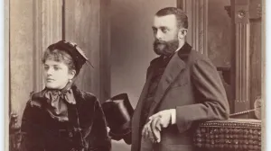 Black-and-white photograph of an elegant young couple, the man and woman both looking to their right