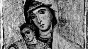 A restored half-length painting of the Virgin Mary wearing a veil holding the Baby Jesus.