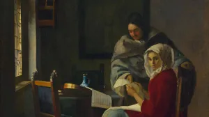 A man showing a paper to a woman in a headscarf seated at a table with a musical instrument