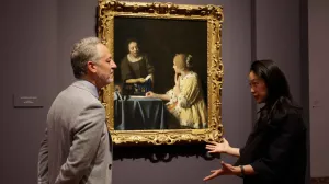 video thumbnail of man and woman in conversation in front of painting in gallery
