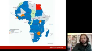 man giving online presentation with map of Africa in background