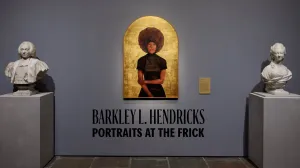 video still of painting of woman against gold background, between two statues