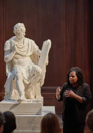 photo of Annette Gordon-Reed giving talk in front of George Washington sculpture