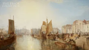 Masted ships at a harbor in a sunny day