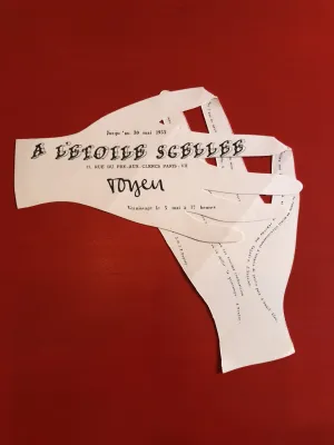 Paper cutout of two hands with words printed on them