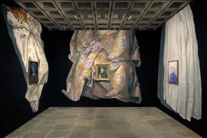 View of gallery with pastel murals of draped cloth on three walls and portraits hung on top of the murals