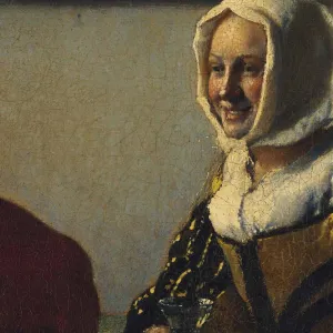 Detail of the cracked surface of a painting showing a woman in a white headscarf smiling