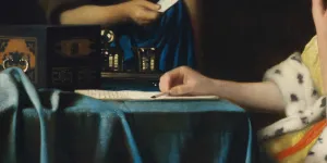 detail of painting in which woman is writing letter