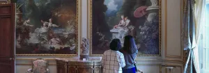 Two women standing in the Fragonard Room