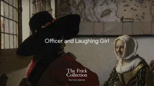 A man and a woman seated at a table by the window with a map on the wall