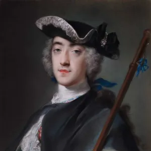 portrait of a man wearing a black hat holding a staff