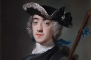 portrait of a man wearing a black hat holding a staff