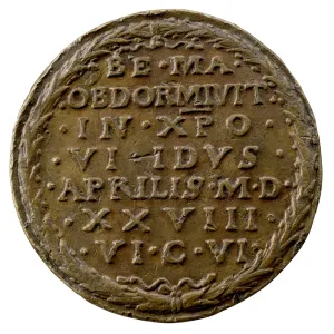 Copper medal with laurel wreath surrounding an inscription