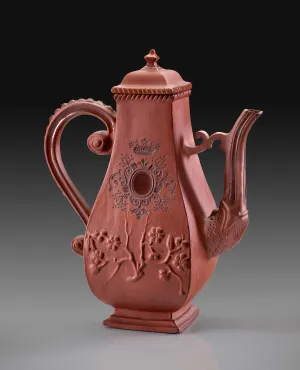 tall red teapot with four sides