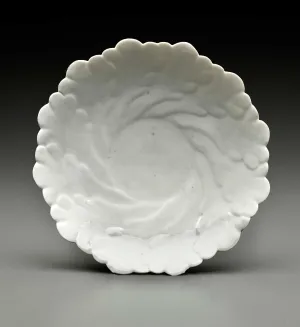 white dish with vegetal relief decoration