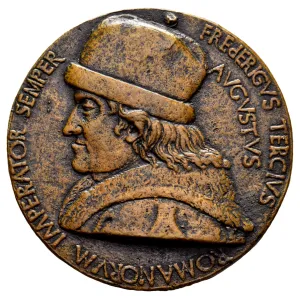 Obverse of a bronze medal depicting a man in profile.