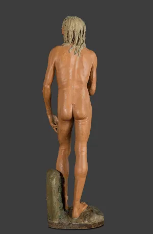 Painted wood sculpture of a nude Saint Jerome seen from the back.