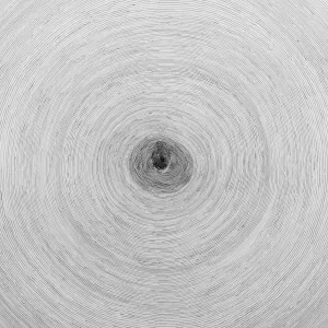 detail of white ceramic disk painted with thin, gray concentric circles and a gray fingerprint at center