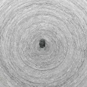 detail of white ceramic disk painted with thin, gray concentric circles and a gray fingerprint at center