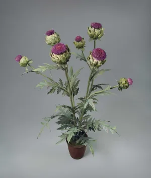 a porcelain sculpture of an artichoke plant in a terracotta pot