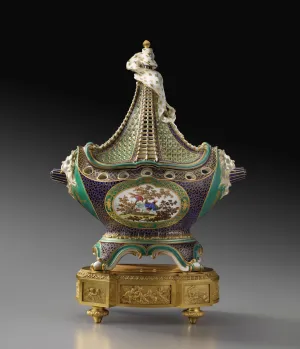 green and gilt porcelain vase in the shape of a masted ship, with intricate decorations