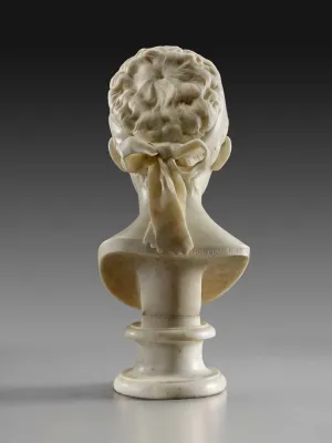 Alternate view of a bust of a young woman looking down with hair pulled back and tied with a ribbon