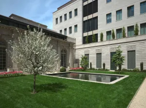 70th street garden of The Frick Collection with tree and reflecting pool