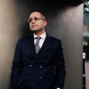 man in suit standing 