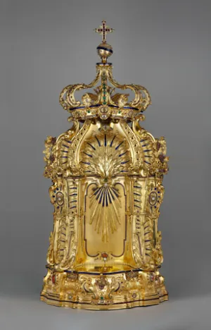 A gold object with a crown