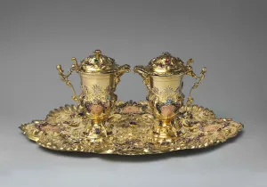 gold tray with two cruets resting on it