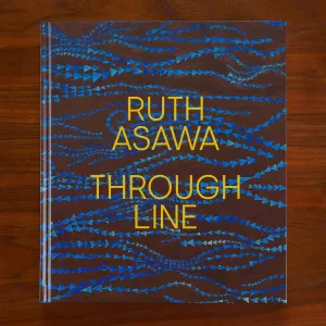Book cover featuring an artwork detail of lines of blue triangles overlaid with the title "Ruth Asawa: Through Line"