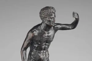 close up of sculpture of nude man