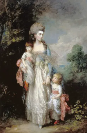 woman in dress with two children
