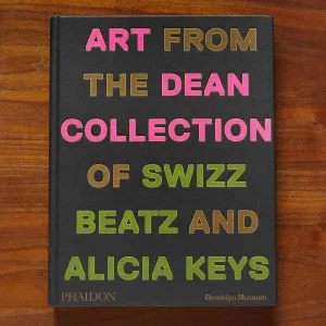 Book cover with large type in pink, brown, and green reading "Art from the Dean Collection of Swizz Beatz and Alicia Keys"