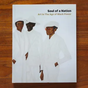 Book cover featuring artwork detail of three Black figures in white suits and white hats
