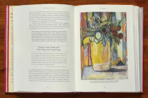 Book open to a spread with a recipe opposite a painting of citrus in a vase