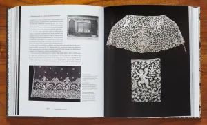 Book open to a spread with images of lace samples